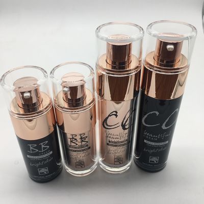 Le bottiglie di vetro della lozione di trucco 30ml 50ml con forma del cilindro della pompa hanno personalizzato il colore